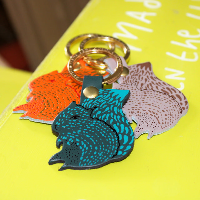 One squirrel key ring design in three different colour ways on a gold plated ring.