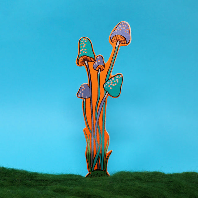 An illustrated orange leather mushroom bookmark