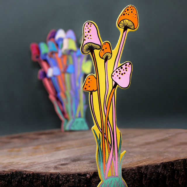 An illustrated yellow leather mushroom bookmark