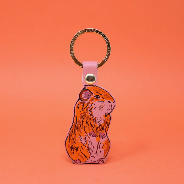 Pale pink guinea pig leather keying with a gold plated ring. Handmade in Cambridge using hot foil.