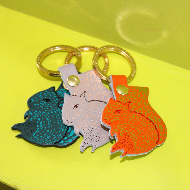 One squirrel key ring design in three different colour ways on a gold plated ring.
