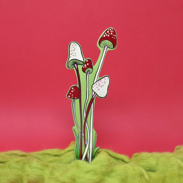 One green leather mushroom bookmark